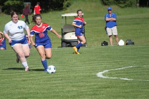 players fighting for the soccer ball